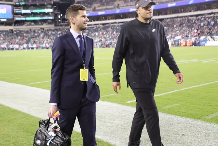 Eagles Vice President of Football Operations and Strategy Alec Halaby (left) walks off the field with Wide Receivers Coach Aaron Moorehead before the Eagles play the Tampa Bay Buccaneers on Thursday, October 14, 2021 in Philadelphia.
