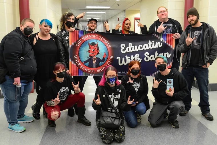 Some members and supporters of the Satanic Temple, the organization that sponsors the 'After School Satan Club,' pose Feb. 28 for a picture after the Saucon Valley School District board meeting.