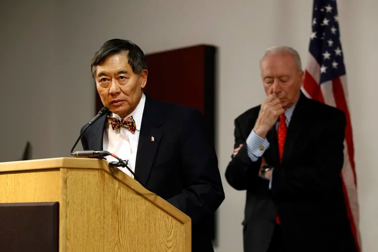 University of Maryland president Wallace Loh, left, speaks at a news conference in front of James Brady, chairman of the University System of Maryland Board of Regents, following the board's recommendation that football head coach DJ Durkin retain his job on Tuesday. They changed their minds one day later.