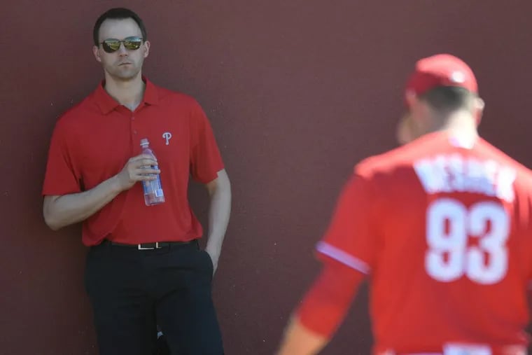 Phillies GM Matt Klentak looks on during spring training workouts at Spectrum Field, in Clearwater Florida. Sunday, Feb. 18, 2018.