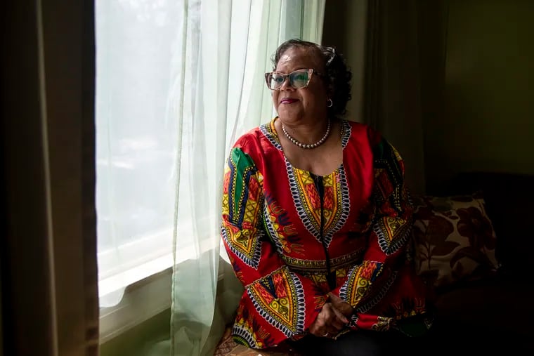 Celestine Tention, 64, a retired human resource manager, who is colon cancer-free, poses for a portrait in her home in Philadelphia on Tuesday. Tention is diligent about getting her colonoscopy every three to five years due to colon cancer running in her family.