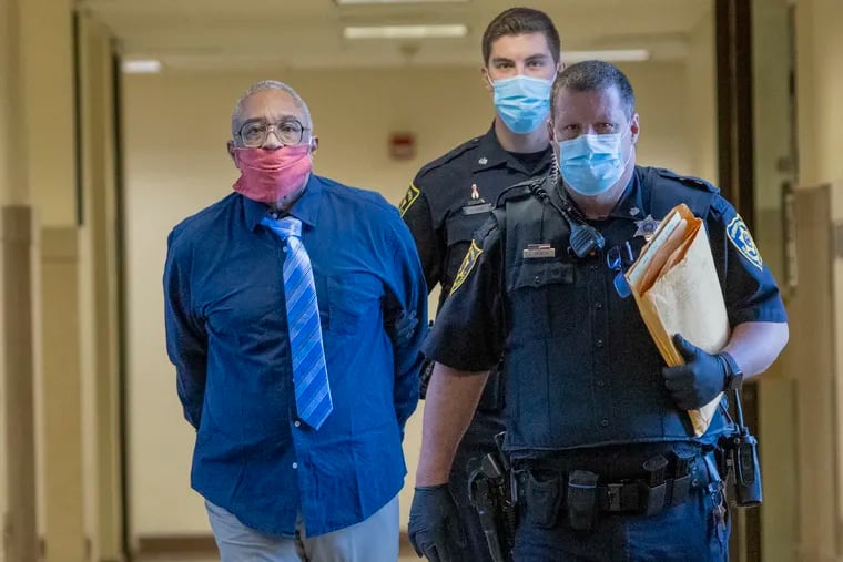 Robert Fisher, 75, is escorted into a courtroom in the Montgomery County courthouse on Monday. Fisher is charged with first-degree murder in the death of Linda Rowden, his ex-girlfriend whom he allegedly killed in 1980.