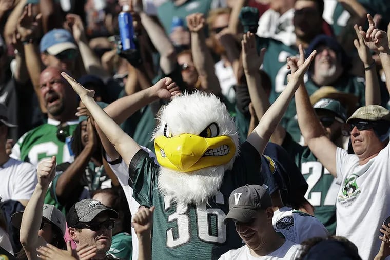 A happy Eagles fan cheerS after the team scored a touchdown against the Chargers last season.