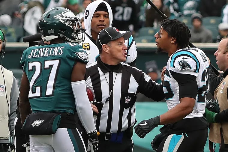 Eagles Malcolm Jenkins is confronted by the Panthers' Eric Reid at Sunday's game at Lincoln Financial Field.