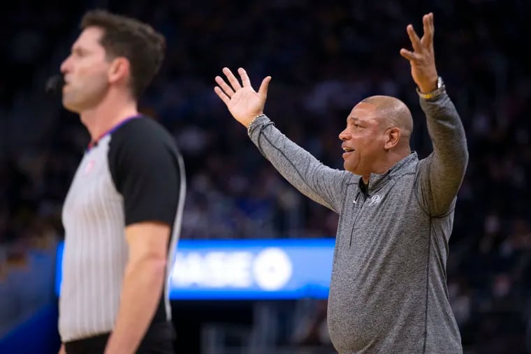 Philadelphia 76ers head coach Doc Rivers, right, questions a referee’s call during the first quarter of an NBA basketball game against the Golden State Warriors, Wednesday, Nov. 24, 2021, in San Francisco. (AP Photo/D. Ross Cameron)