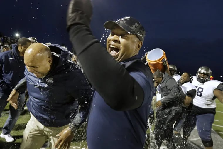 Timber Creek football coach Rob Hinson is doused with water in the closing seconds of the team's 31-10 win over Lenape in the South Jersey Group 4 title game in 2016.