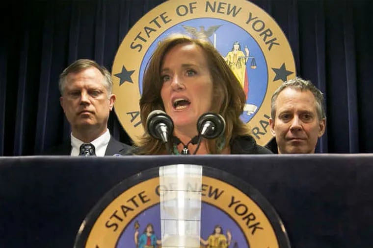 Nassau County District Attorney Kathleen Rice speaks. Behind her are (from left) Annie Palazzolo, whose sister was killed for a cellphone; her father, Paul Boke; New York Attorney General Eric Schneiderman; and San Francisco District Attorney George Gascon. (Bebeto Matthews / AP)
