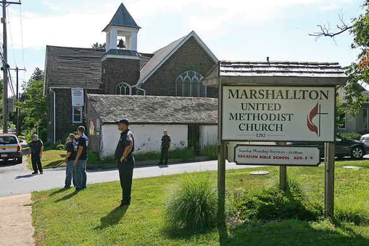 AKIRA SUWA / Staff photographerAt the Marshallton United Methodist Church near West Chester, which sponsored the Hungarian students and teachers, firefighters and police stand guard to ensure the group's privacy.