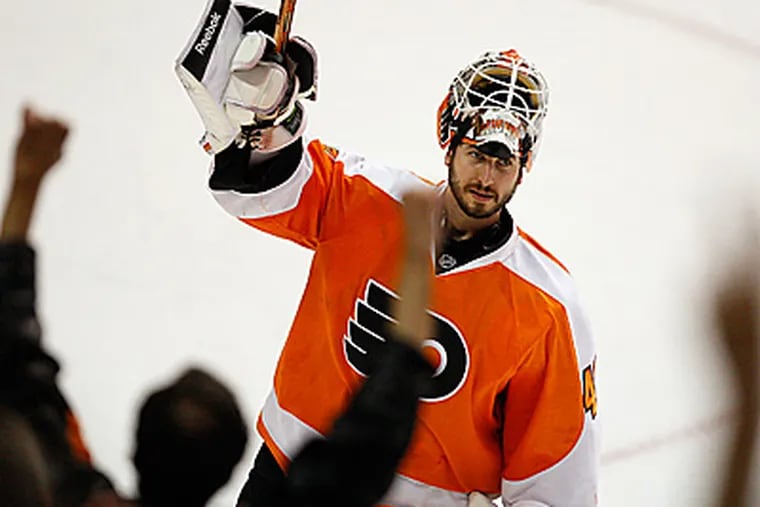 Michael Leighton salutes the crowd after he shut out Montreal for the second game in a row. (David Maialetti/Staff Photographer)