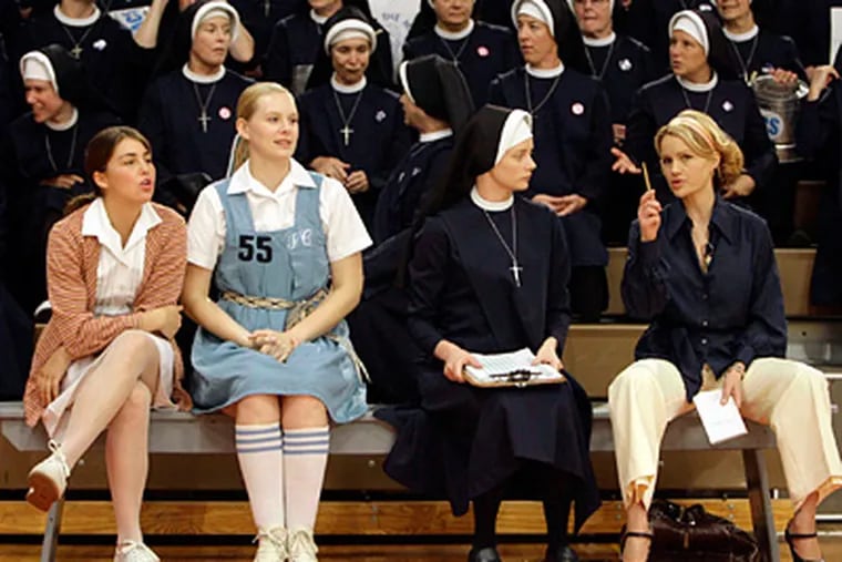 On set in West Chester for “The Mighty Macs” are (from left) Meghan Sabia, Taylor Steel, Marley Shelton as Sister Sunday, and Carla Gugino as Immaculata coach Cathy Rush. After much travail, the movie is set to be released. (Matt Rourke / Associated Press)