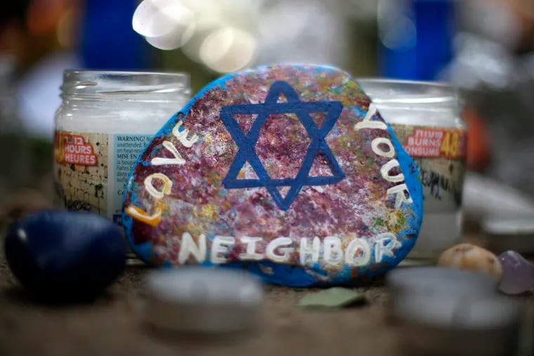 This Wednesday, Oct. 31, 2018, file photo, shows a painted rock found as part of a makeshift memorial outside the Tree of Life Synagogue in the Squirrel Hill neighborhood of Pittsburgh, in honor of the people killed during worship services several days earlier. (AP Photo/Gene J. Puskar, File)