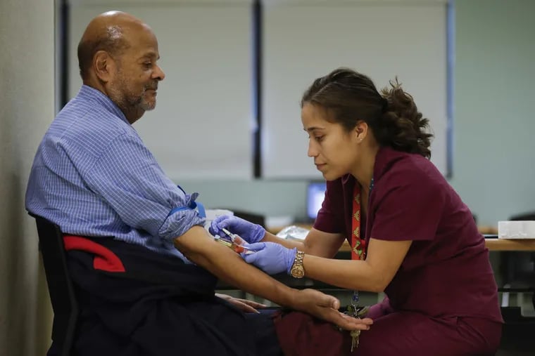 In a file photo, a medical assistant draws blood during 2016 testing program in New York for residents exposed to PFAS in their drinking water. New York, Pennsylvania, and New Jersey have received federal grants to participate in a national study of the health impacts of PFAS.