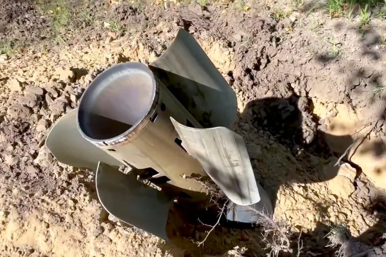 In this photo taken from video and released by Russian Defense Ministry Press Service on Sunday, a rocket fragment after shelling is seen near the Zaporizhzhia Nuclear Power Station in territory under Russian military control, southeastern Ukraine.