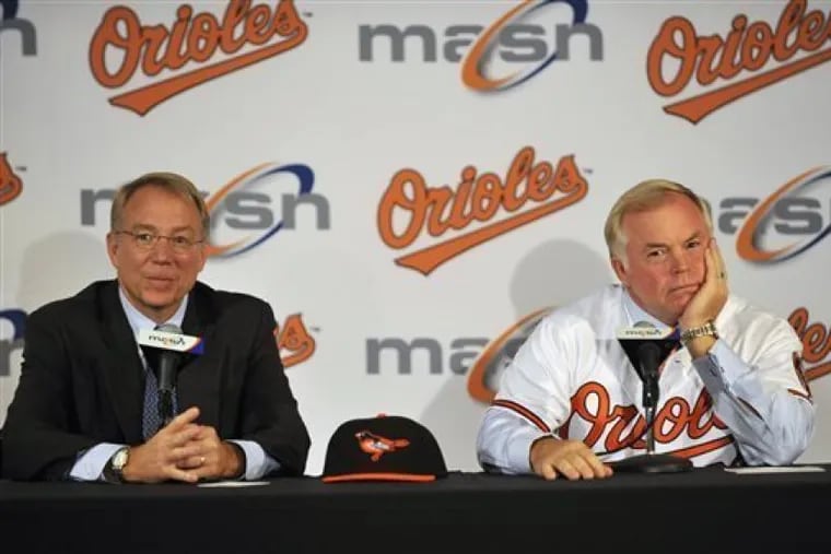 Andy MacPhail, left, and Buck Showalter at a news conference to announce the hiring of Showalter as the Baltimore Orioles' manager in 2010.