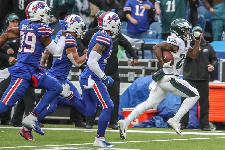 Philadelphia Eagles running back Miles Sanders pulls away from Buffalo Bill defenders as he races toward the end zone in the start of the third quarter for a 65 yard touchdown run.