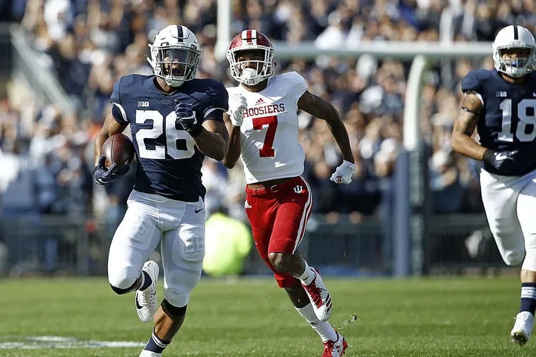 Penn State’s Saquon Barkley (26) takes the opening kick off 98 yards for a touchdown against Indiana during the first half of an NCAA college football game in State College, Pa., Saturday, Sept. 30, 2017.