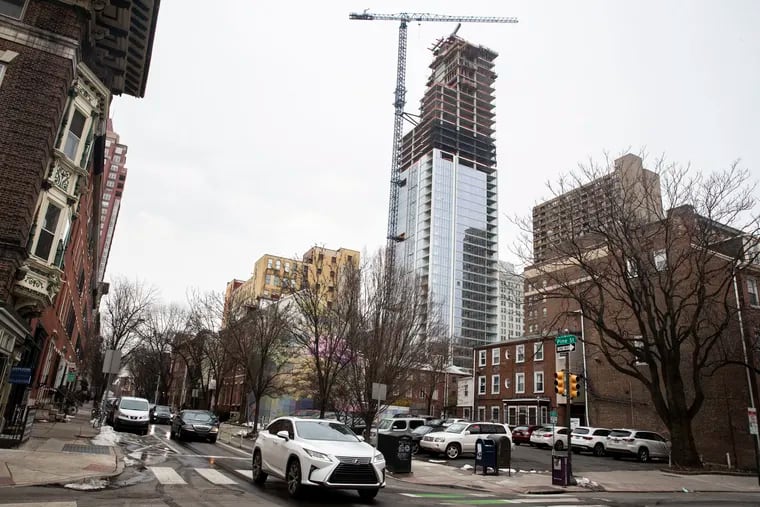 The Arthaus apartment building under construction on South Broad Street in Philadelphia in 2021, as seen from 13th and Pine Streets. The city is seeing more residential construction these days than the bordering Pennsylvania counties.