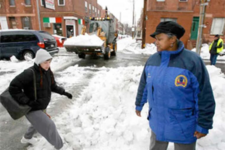 Streets Commissioner Clarena Tolson inspects snow removal taking place on Carlisle Street in South Philadelphia. (Charles Fox / Staff Photographer)
