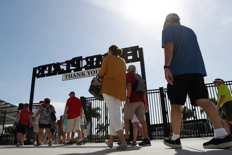 Fans leaving Thursday's spring-training game between the Phillies and Tampa Bay Rays at Charlotte Sports Park in Port Charlotte, Fla.