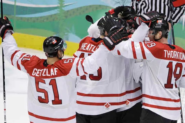 Team Canada celebrates after 7-3 win over Russia in quarterfinal round.