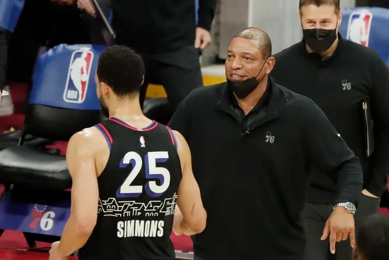 Sixers head coach Doc Rivers greets players during timeout in the first quarter of the Milwaukee Bucks at Philadelphia 76ers NBA game at the Wells Fargo Center in Phila., Pa. on March 17, 2021.