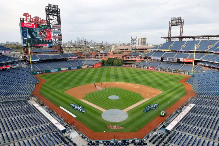 The Phillies grounds crew at Citizens Bank Park readies the field for Friday's game against the Atlanta Braves.