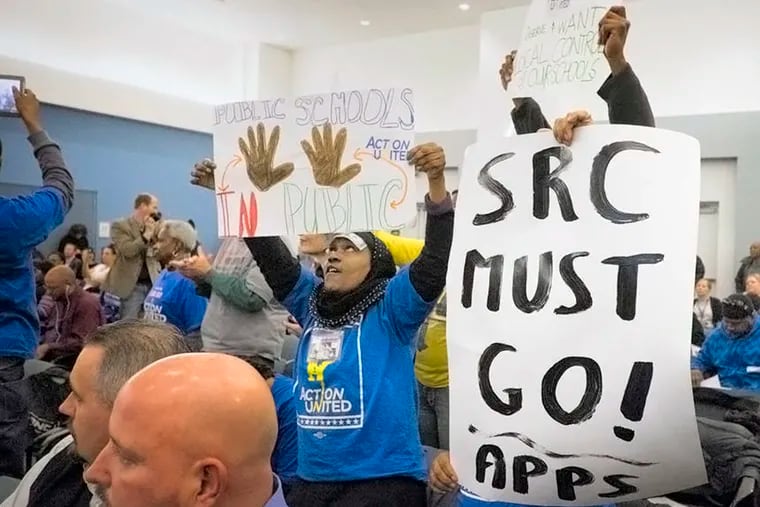Protestors who were not in favor of charter schools disrupted the opening proceedings of the School Reform Commission meeting Wednesday, February 18, 2015 . ( ED HILLE / Staff Photographer )