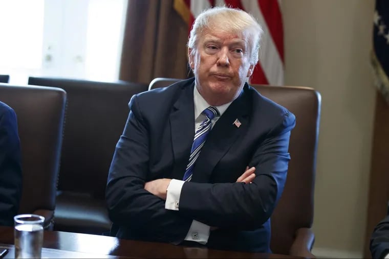 In this March 8, 2018, file photo, President Donald Trump listens during a cabinet meeting at the White House in Washington.