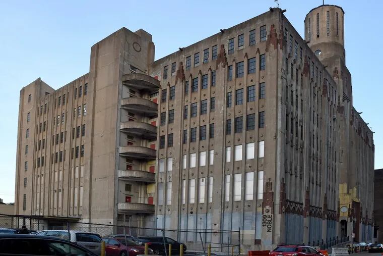The art deco Lasher Printing Company building on Noble Street, across from the new Reading Viaduct park, is still a working industrial building.