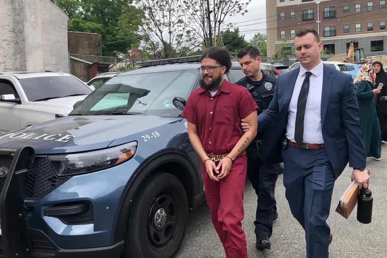 Ramon Garcia is escorted of a magisterial district courthouse in Jenkintown after waiving his preliminary hearing on Friday. Garcia is accused of sexually assaulting 11 women while posing as a nurse at an urgent care clinic where he worked.