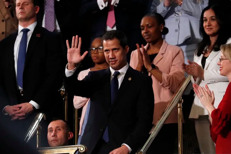 Venezuelan opposition leader Juan Guaido waves as President Donald Trump delivers his State of the Union address to a joint session of Congress on Capitol Hill in Washington, Tuesday, Feb. 4, 2020.