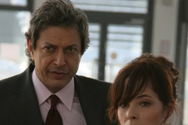 Parker Posey, as the title character, with Jeff Goldblum, as an American intelligence agent.