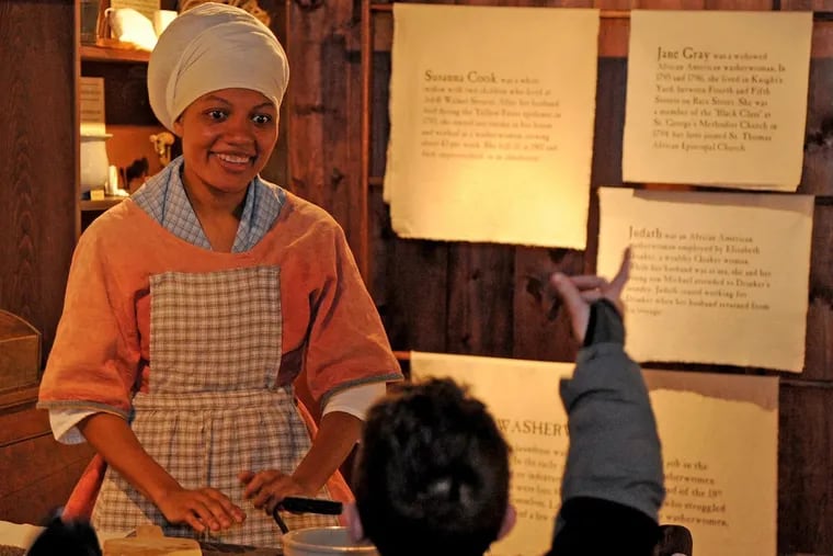 Phillis, played by Courtney Mitchell, teaches Betsy Ross House visitors about life as a colonial washerwoman.