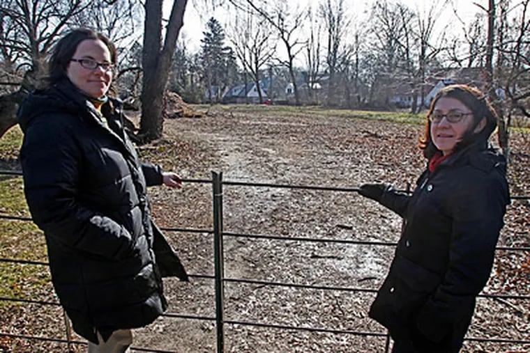 At the meadow are the Lower Merion Conservancy's Patty Thompson (left) and Rita Auritt. &quot;It's a big deal to protect property like this in such a developed area,&quot; Thompson said. (Akira Suwa / Staff Photographer)