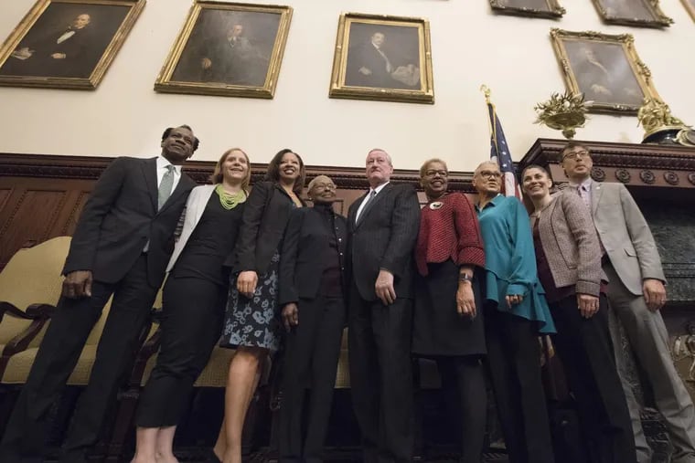 Mayor of Philadelphia, Jim Kenney, center, poses for a photograph with newly introduced school members, from left, Wayne Walker, Mallory Fix Lopez, Angela McIver, Julia Danzy, Joyce Wilkerson, Leticia Egea-Hinton, Maria McColgan and Lee Huang. The new school board members where introduced during a press conference at the City Hall. Chris McGinley was not in attendance.