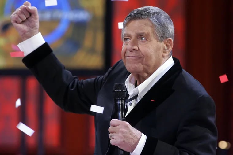In this Sept. 1, 2008 file photo, Jerry Lewis listens to the final tally of donations during the 43rd annual Muscular Dystrophy Association Labor Day Telethon.