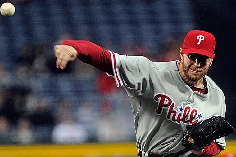 On Wednesday night, Roy Halladay needed 95 pitches to get 10 outs, nine of which came on strikeouts. (John Amis/AP)