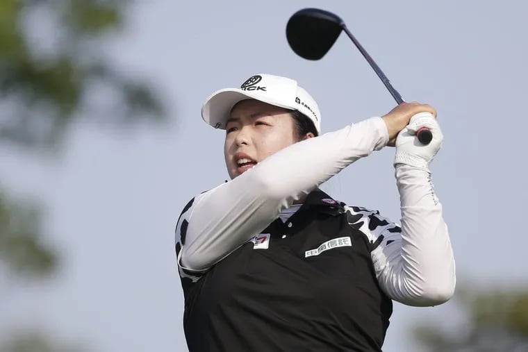 Shanshan Feng tees off on the 13th hole during the first round of the U.S. Women’s Open.