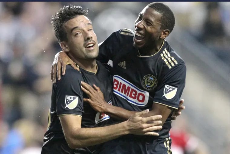Raymond Gaddis (right) celebrates a goal with Ilsinho during the Union’s 3-1 win over the Chicago Fire.