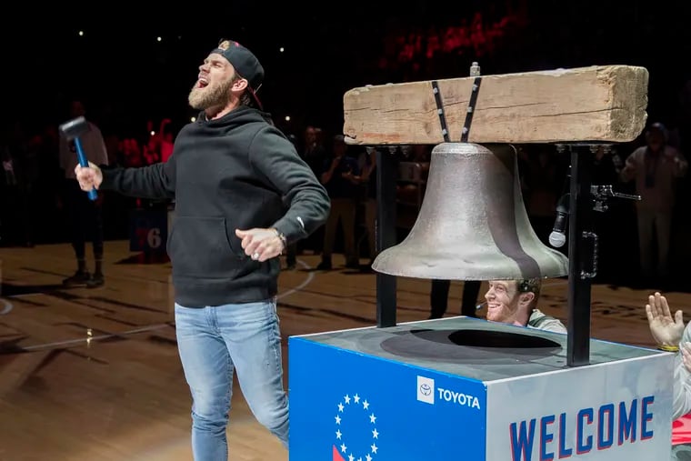 Bryce Harper of the Phillies rang the Liberty Bell replica before the game between the Sixers and  the Bucks at Wells Fargo Center during the 1st half on April 4, 2019.