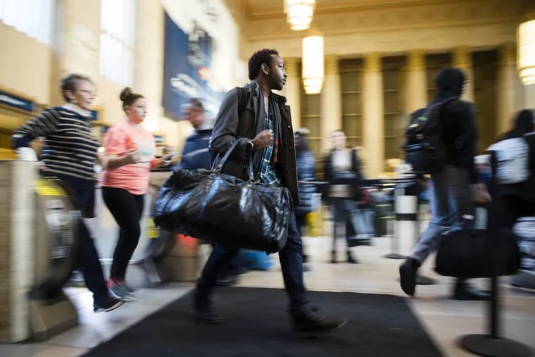 Travelers make their way through 30th Street Station ahead of the Thanksgiving Day holiday last year.