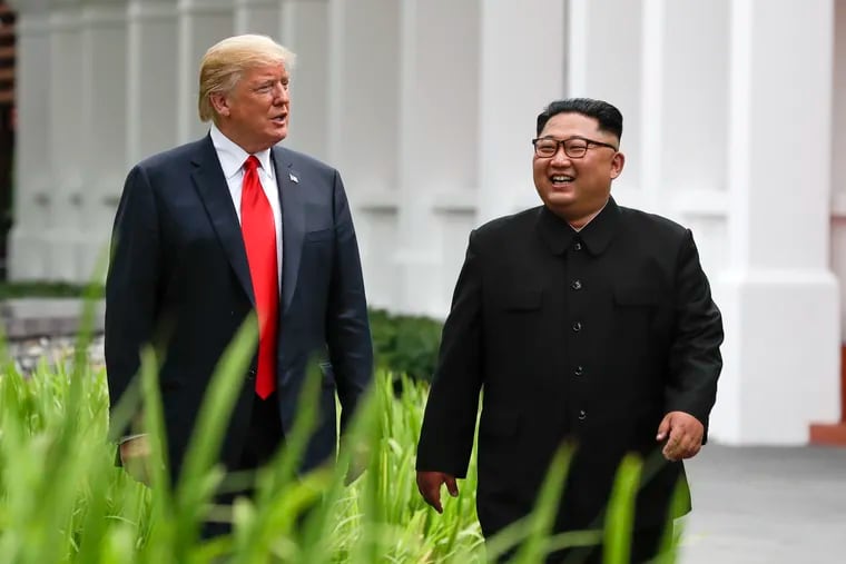 U.S. President Donald Trump and North Korea leader Kim Jong Un walk from their lunch at the Capella resort on Sentosa Island Tuesday, June 12, 2018 in Singapore.