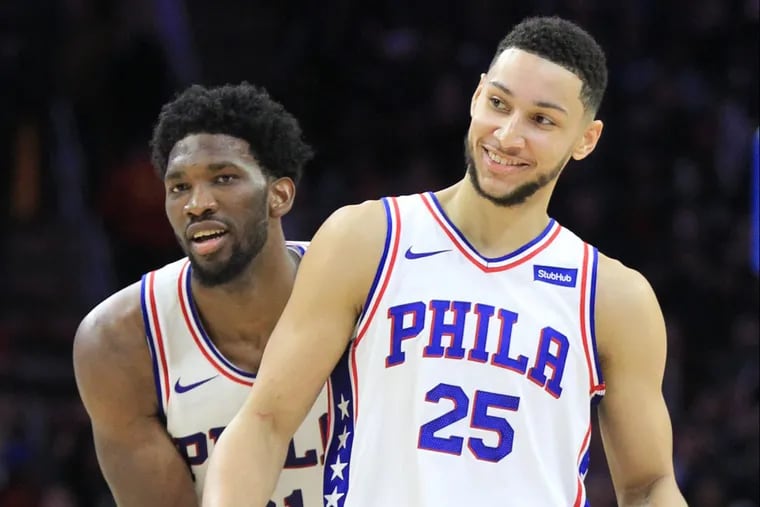 Joel Embiid, left, and Ben Simmons celebrating after a play in December.