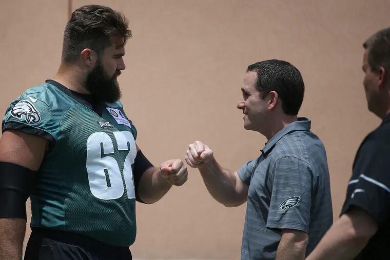 Howie Roseman (right) is hoping one of the two sixth-round compensatory draft picks the Eagles were awarded can be as good as 2011 sixth-rounder Jason Kelce (left).
