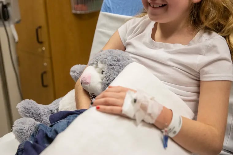Keira McGrenehan, 10, sits with her stuffed animal after receiving her Remicade infusion for colitis at the Center for GI Motility of Children's Hospital of Philadelphia on Wednesday, Dec. 12, 2018.