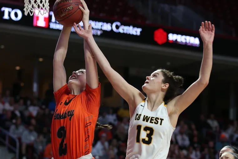 Ava Sciolla of Pennsbury and Emily Spratt of Central Bucks West go after a rebound in the District 1 title game.