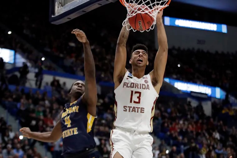 Florida State's Anthony Polite dunks against Murray State's Brion Sanchious during the second round last Saturday. Take the 'Noles and the points on Thursday, says our handicapper. And don't be surprised if they beat Gonzaga outright.