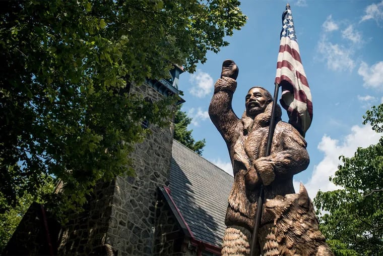 A statue of North Pole explorer Matthew Henson stands outside of the Camden Shipyard & Maritime Museum. The museum, in a former church called the Church of Our Savior, will open in September.