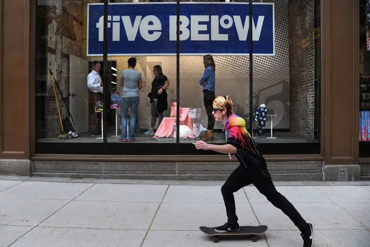 Joel Anderson (left) , CEO of Philadelphia-based Five Below talks to employees in the display window as he gets ready October 25, 2017 to open their newest store in the historic Litz Building on East Market Street.