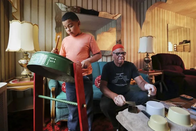 Asaf, 9 and Raul Berrios, 64, in the living room of their South Philadelphia home on Thursday, November 9, 2017. They left Carolina, Puerto Rico after Hurricane Maria destroyed the island.
